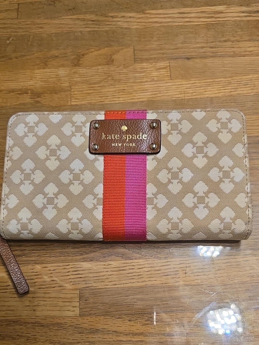kate spade beige wallet with pink & orange center stripe